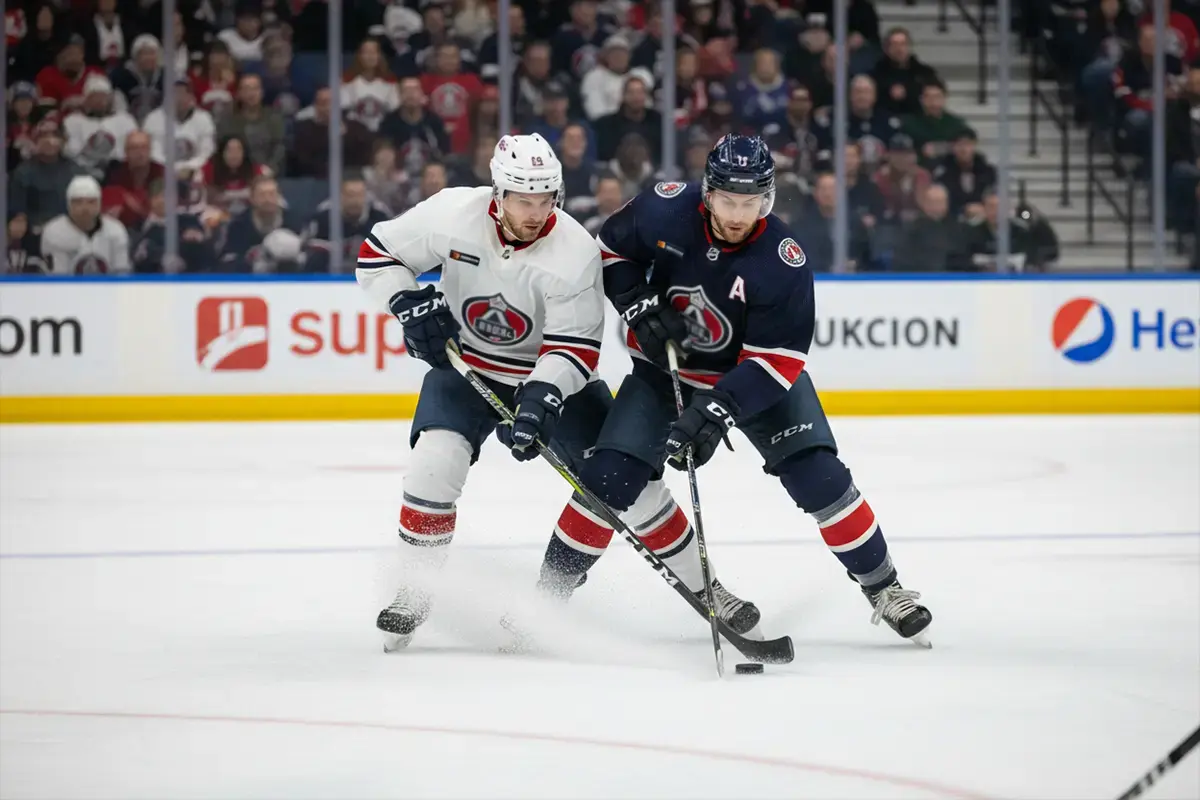 NHL-Eishockeyspiel: Spieler am Puck im Angriffsdrittel